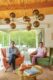 homeowners sit in redesigned colorful Krisel home