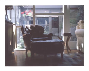 a brown leather chair and a matching ottoman