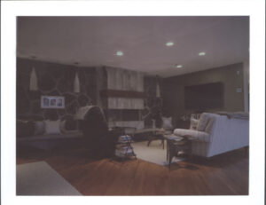 a striped couch and a reclining chair in a living room