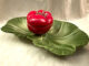 Brad Keeler's "chip and dip" ceramic art, featuring a tomato on a lettuce leaf