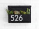 You’ve Got Mail mailbox with planter and house numbers