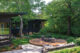 Milwaukee mid century modern landscape with elevated fire pit and black Acapulco chairs