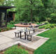 modern home backyard with patio picnic table and fire pit
