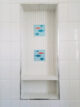 modern fish accent tile in built in shower shelf