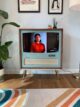 retro TV stand with present day TV