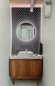 powder room with tiled accent wall and vessel sink
