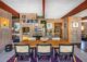 dining room with concrete blocks and rattan backed dining chairs