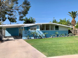 exterior of 1959 Haver home blue painted cement blocks