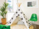 black and white fabric teepee in kids' playroom