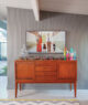 merry minimal modern holiday home decorated credenza and family portrait