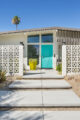 entrance to MCM home with concrete blocks for fence