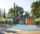 epic Eichler renovation exterior of home with orange garage and front doors