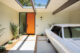 classic car and orange door and classic Eichler siding in renovated Eichler home