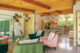 colorful Palmer and Krisel home with armchairs in green and pink