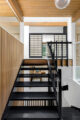 stairway surrounded by slat walls and ceiling