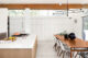 clerestory windows in white and wood kitchen and dining area of MCM 1960 Washington home