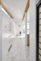 clerestory windows, original wood beams and white cabinetry in 1960 Washington home