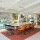 dining room with view to backyard pool and lounge area in renovated Palm Springs home