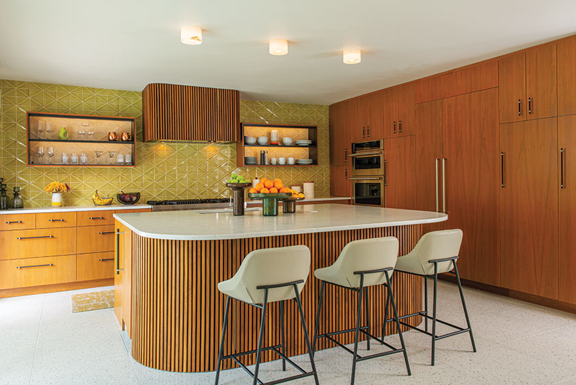 kitchen with textured yellow backsplash and island with Eichler style siding