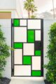 modern exterior door with rectangular pattern and lime green accents