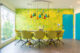 Shag House colorful dining room with accent wall of Shag artwork