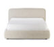 a white upholstered bed with wraparound footboard