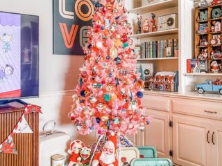pink Christmas tree in home with mid century collectibles