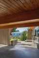 A view through a carport of a mid century modern home in Boise, Idaho.