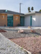 the exterior front view of a mid century modern home in las vegas with xeriscaping