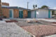 the exterior front view of a mid century modern home in las vegas with xeriscaping