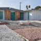 the exterior front view of a mid century modern home in las vegas with xeriscaping