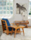 a set of heywood wakefield (chair, side table and console table) in a white room