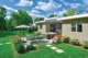 A mid century modern backyard in Wisconsin with square stepping pavers on the right leading to the concrete patio pad