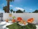 two homecrest swivel chairs with bright orange upholstery