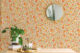 a bright and cheerful floral pattern in warm shades of orange and yellow
