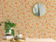a bright and cheerful floral pattern in warm shades of orange and yellow
