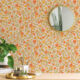 a bright and cheerful floral pattern in warm shades of orange and yellow