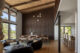 A picture of a dining area with Mid-Century Modern inspired light fixtures.