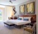 modern bedroom with double art above the headboard