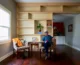 Danny Moulder in front of shelves he designed