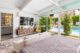 a view of a bedroom looking out onto the backyard pool